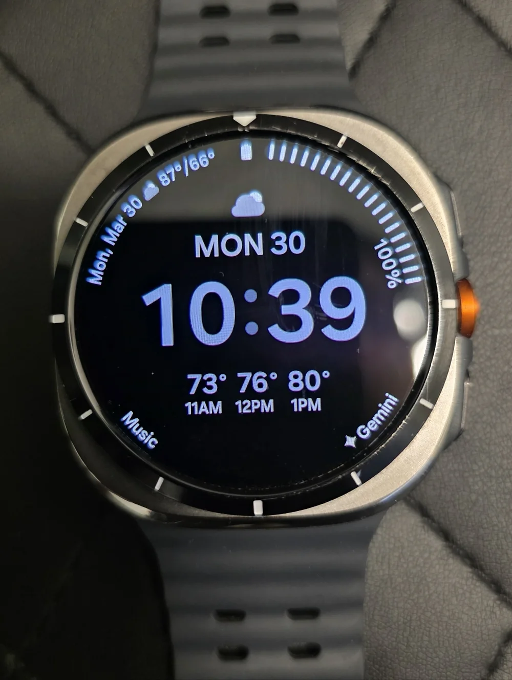 Samsung Gray Smartwatch with Orange Accent and Dark Gray Band